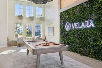Recreation room with billiards table and living wall